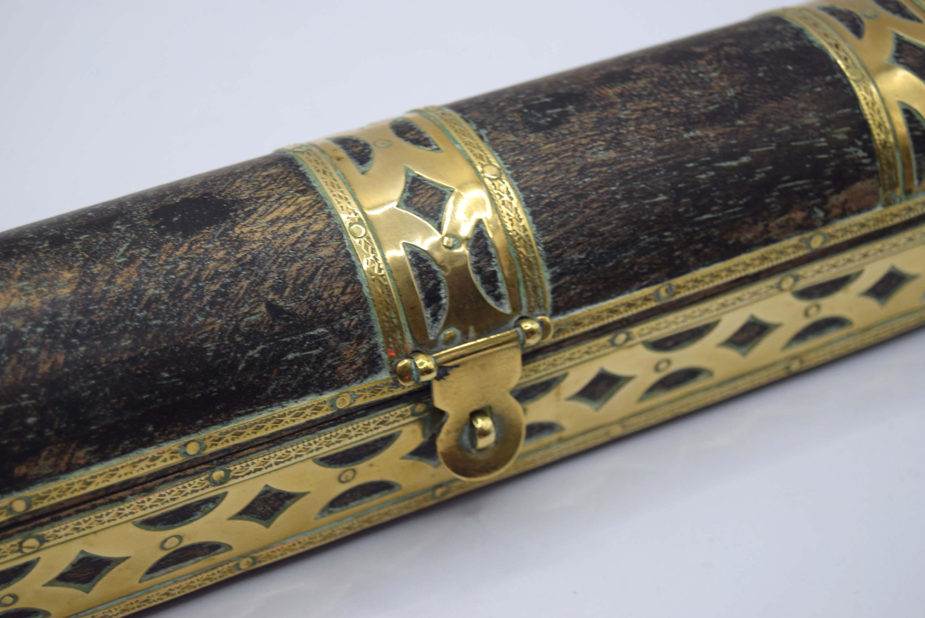 Decorative wooden box with gold embellishments on a white background