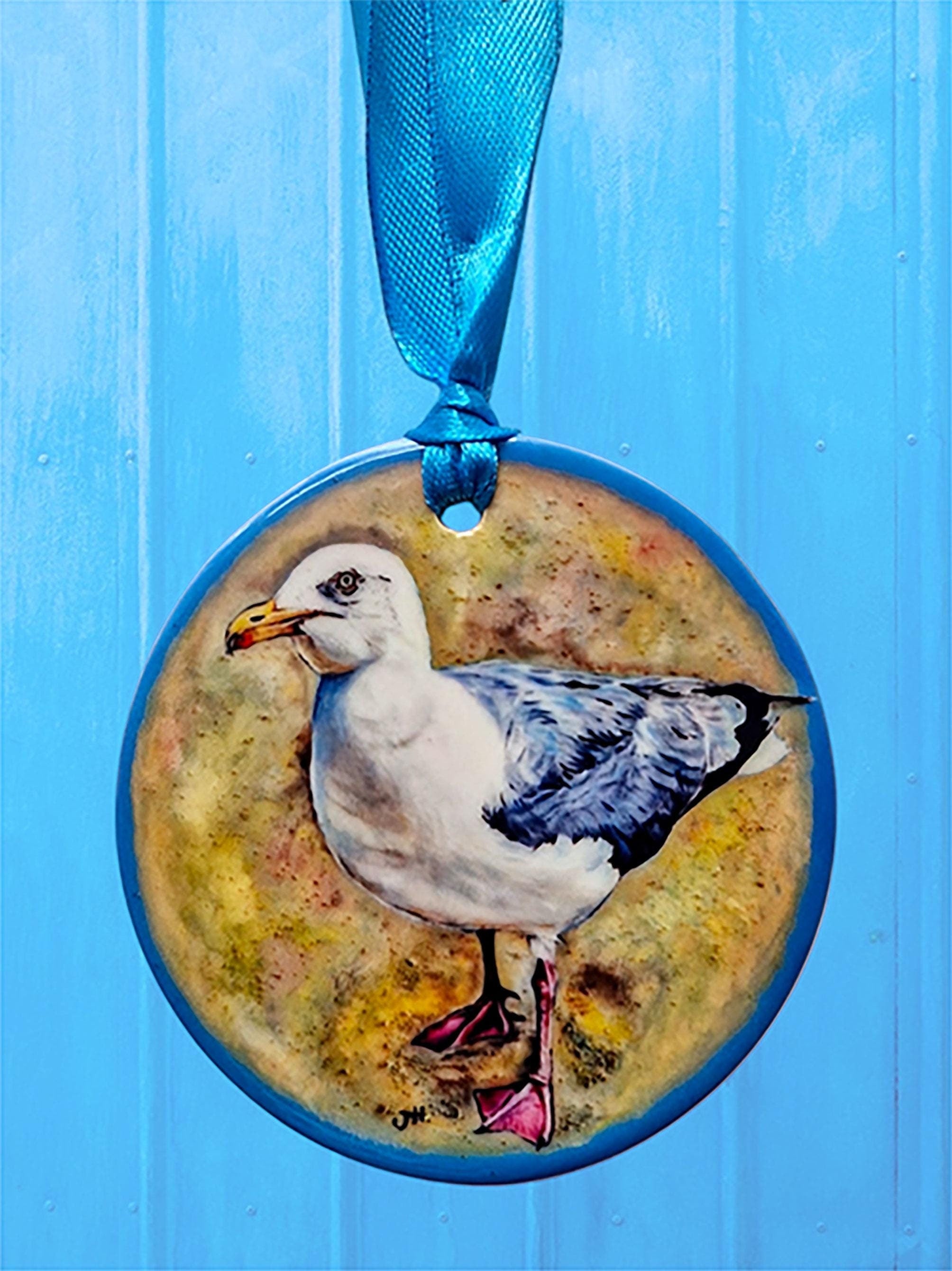 Ceramic disc hanging ornaments depicting a collection of fun and festive animals - all from original oils by Jess Harris