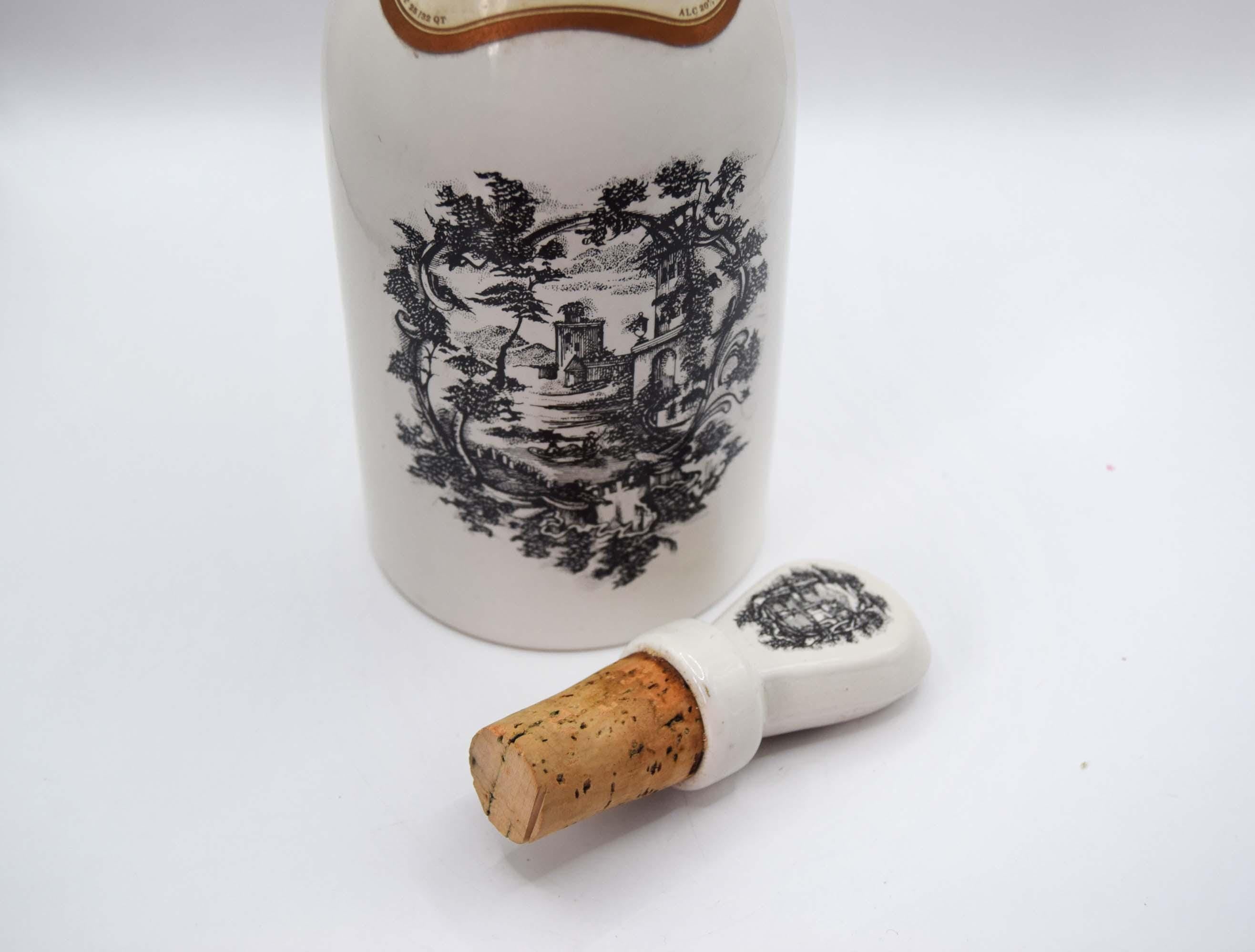 Decorative bottle with cork on a white background