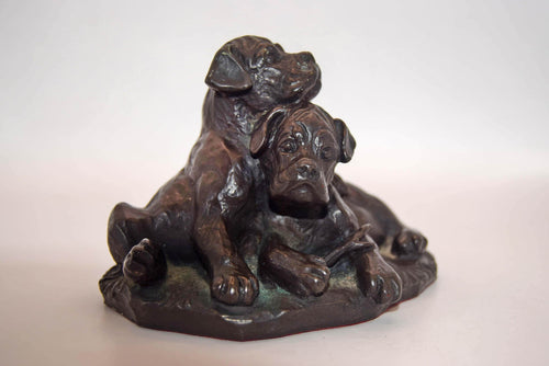 vintage cold cast bronze resin figurine of two boxer puppies, made by the British company Heredities.
