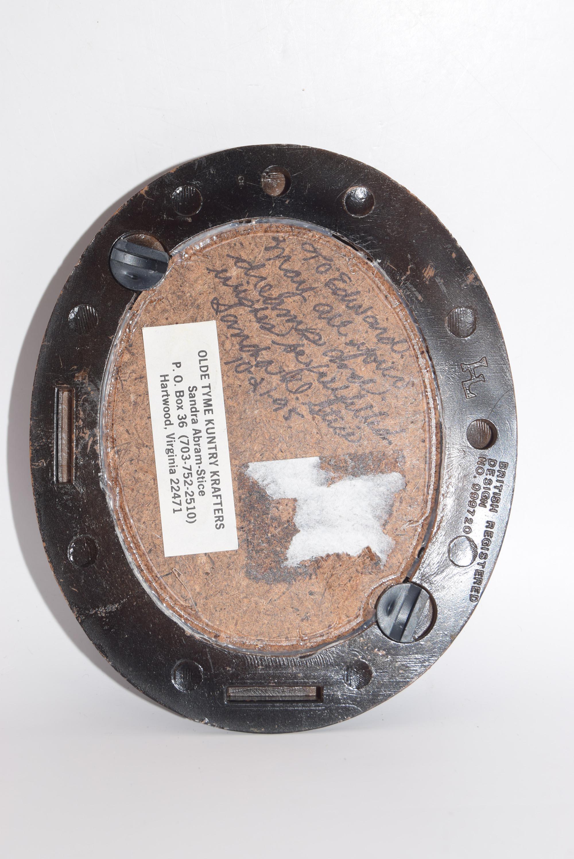 Metallic object with a textured surface and a label on a white background