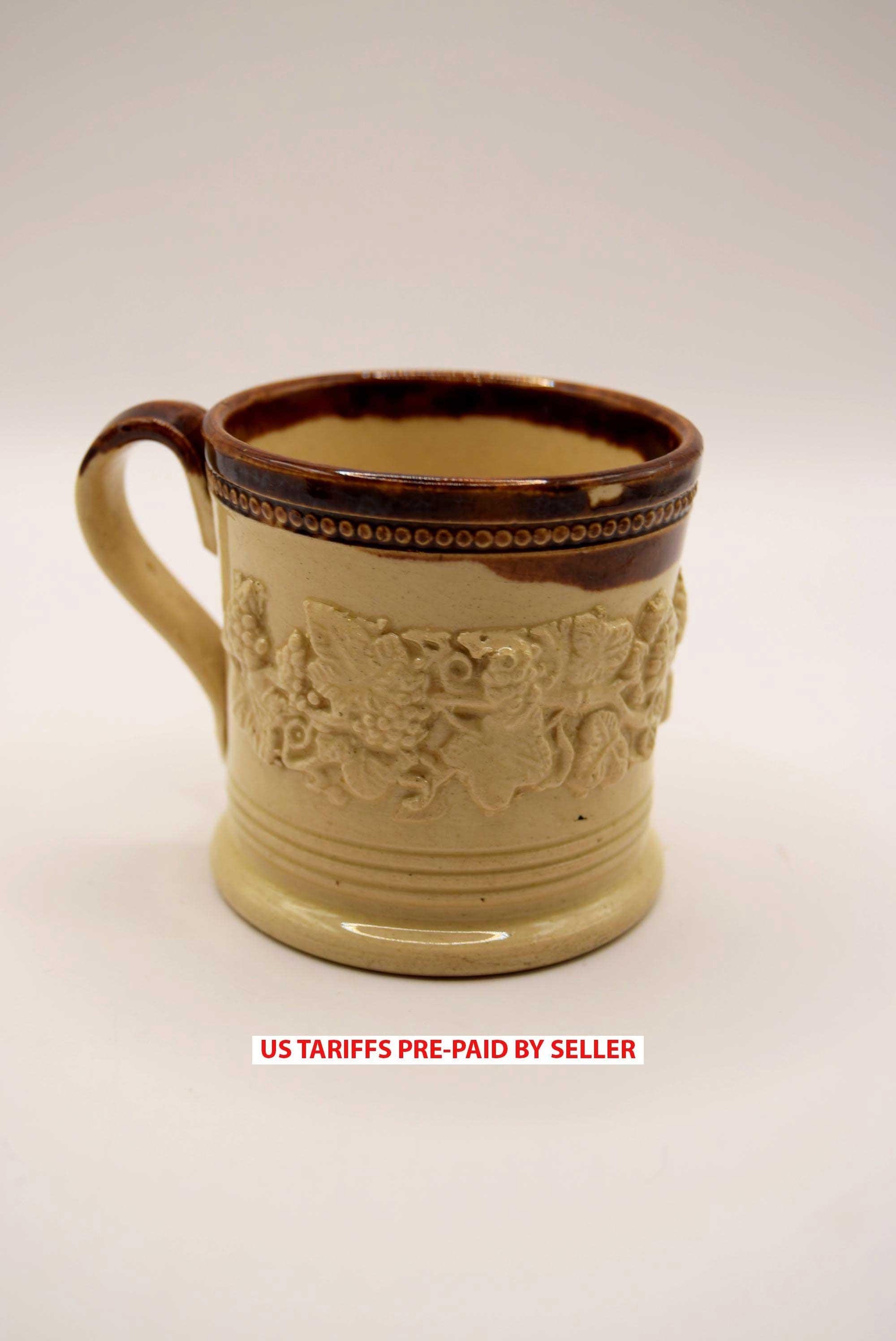 A rare, classic small children's 19th c. English Staffordshire pottery salt glaze cup, mug or coffee can embellished with flowers, l