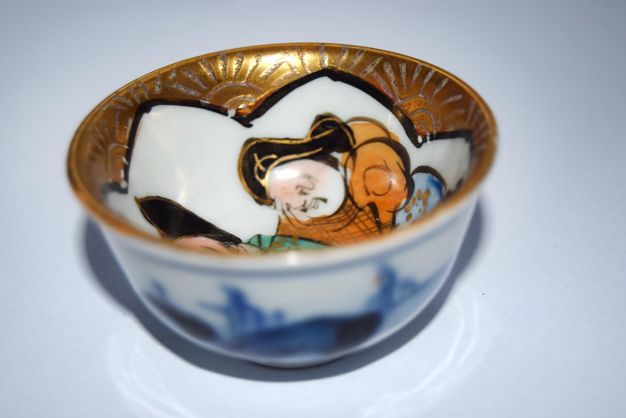 Decorative ceramic bowl with artistic design on a white background
