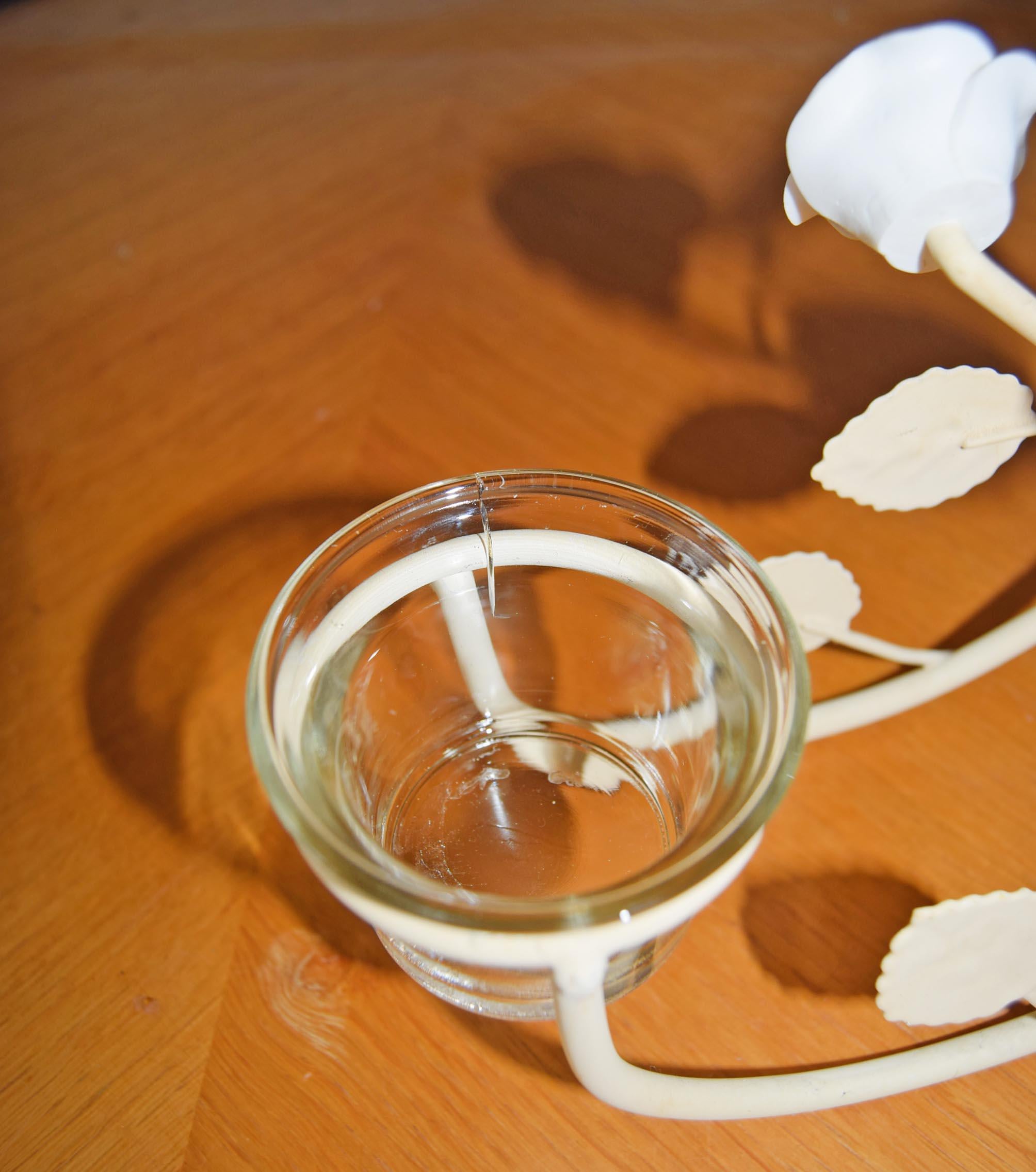Glass container with a white substance on a wooden surface