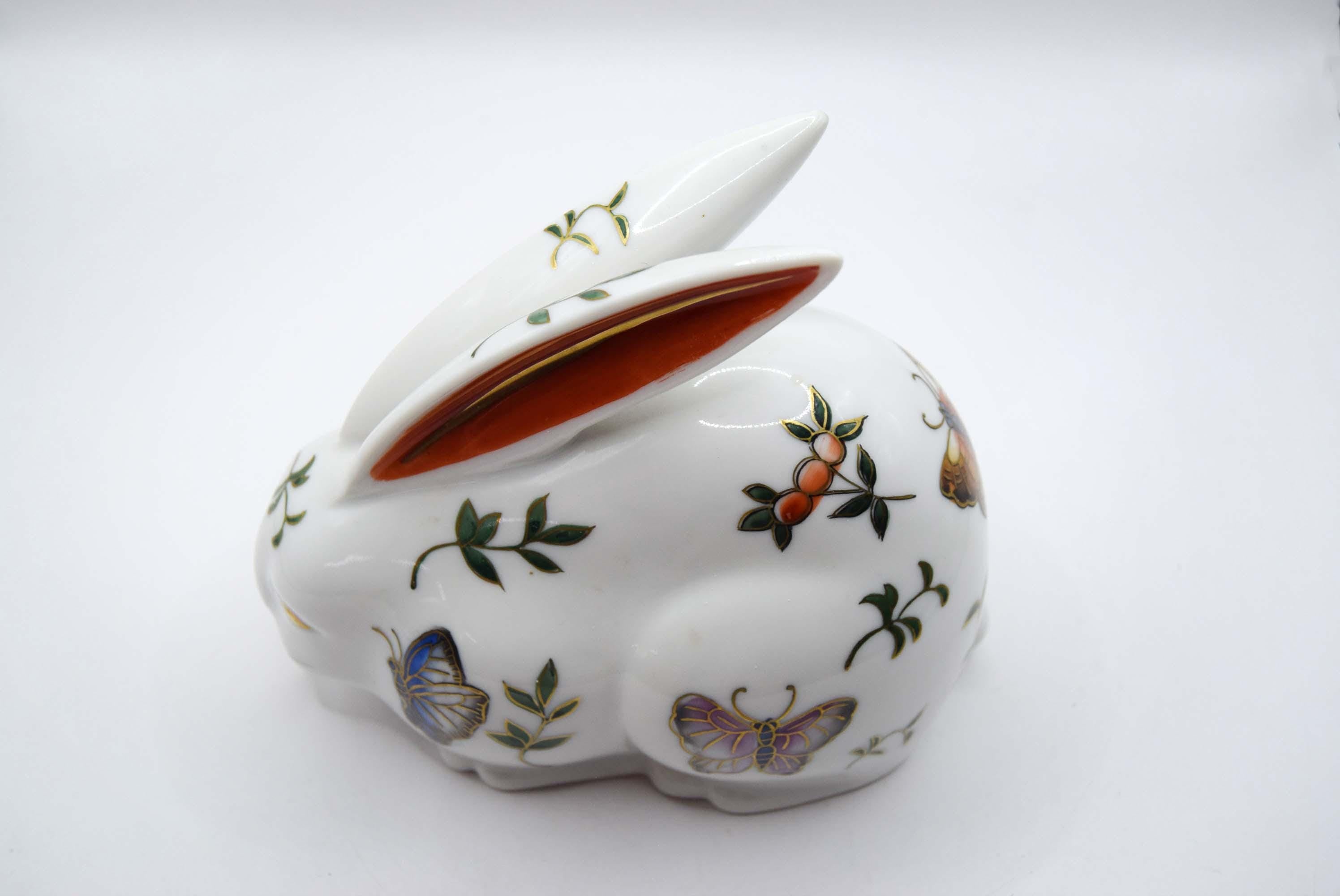 Decorative ceramic rabbit with painted designs on a white background