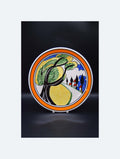 Decorative plate with artistic design of trees and people on a black background