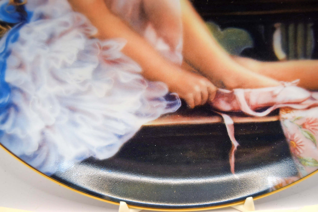 Decorative plate with a ballerina and a shoe on a stand