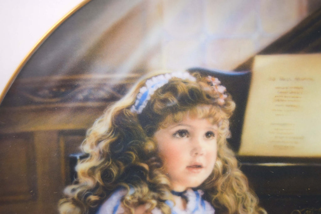 Painting of a young girl with curly hair and a headband, sitting in front of a piano.
