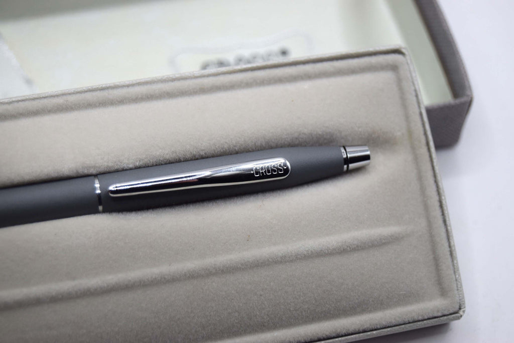 Pen with 'Cross' branding on a light gray cushioned box