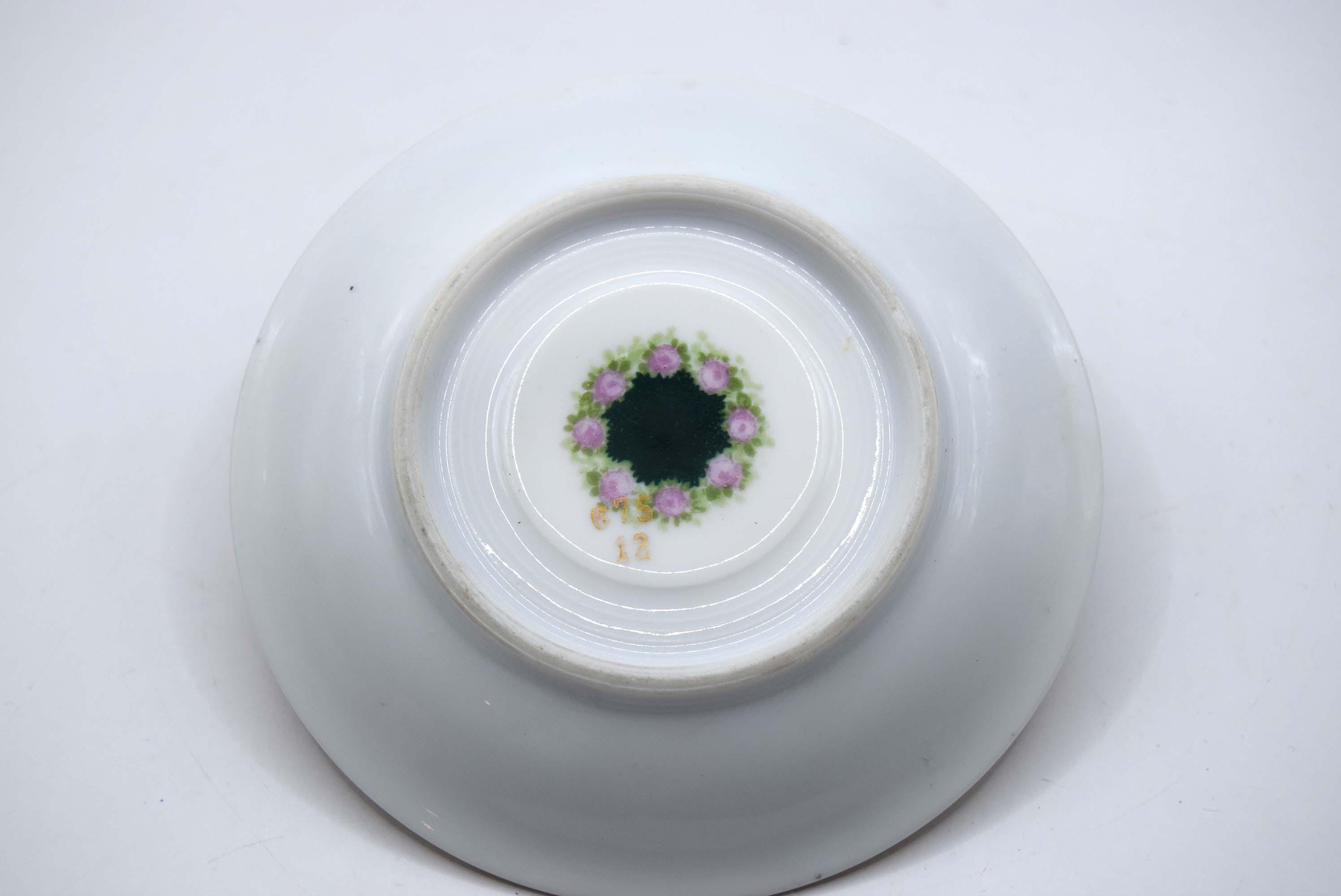 White ceramic bowl with decorative floral pattern on a white background