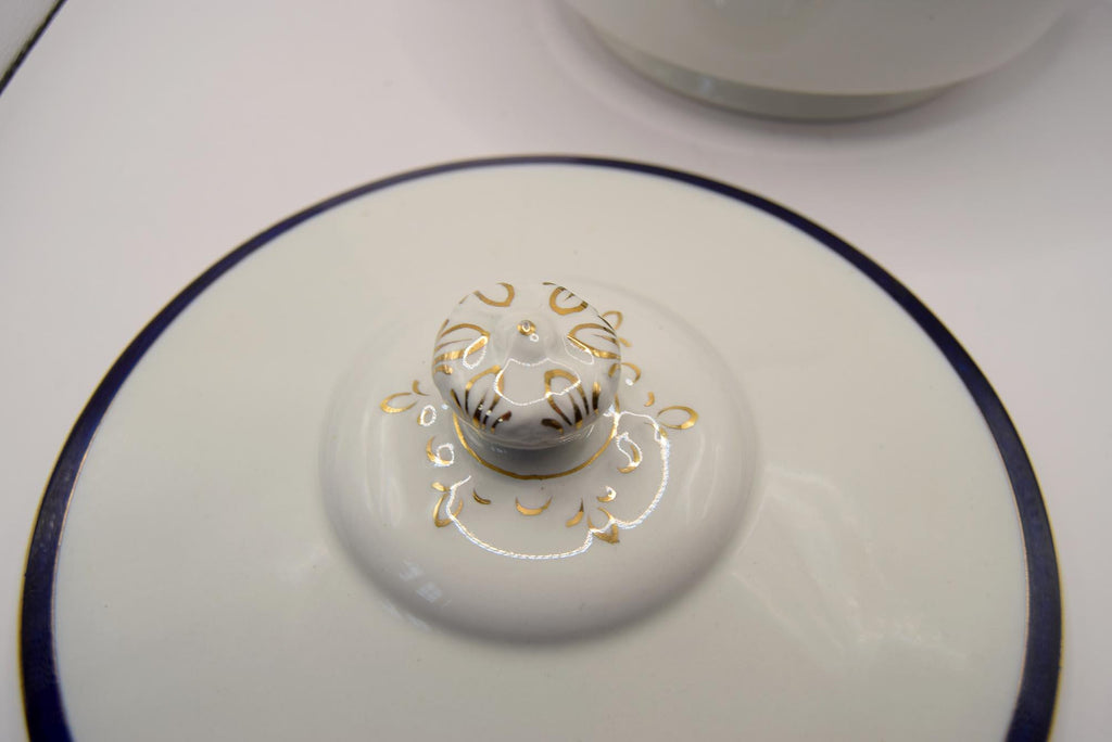 Close-up of a decorative ceramic dish with intricate patterns on a white background