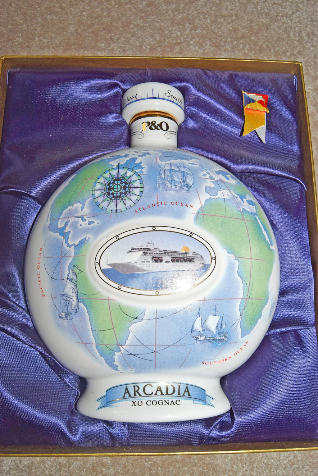 Arcadia XO Cognac bottle with world map design in a box