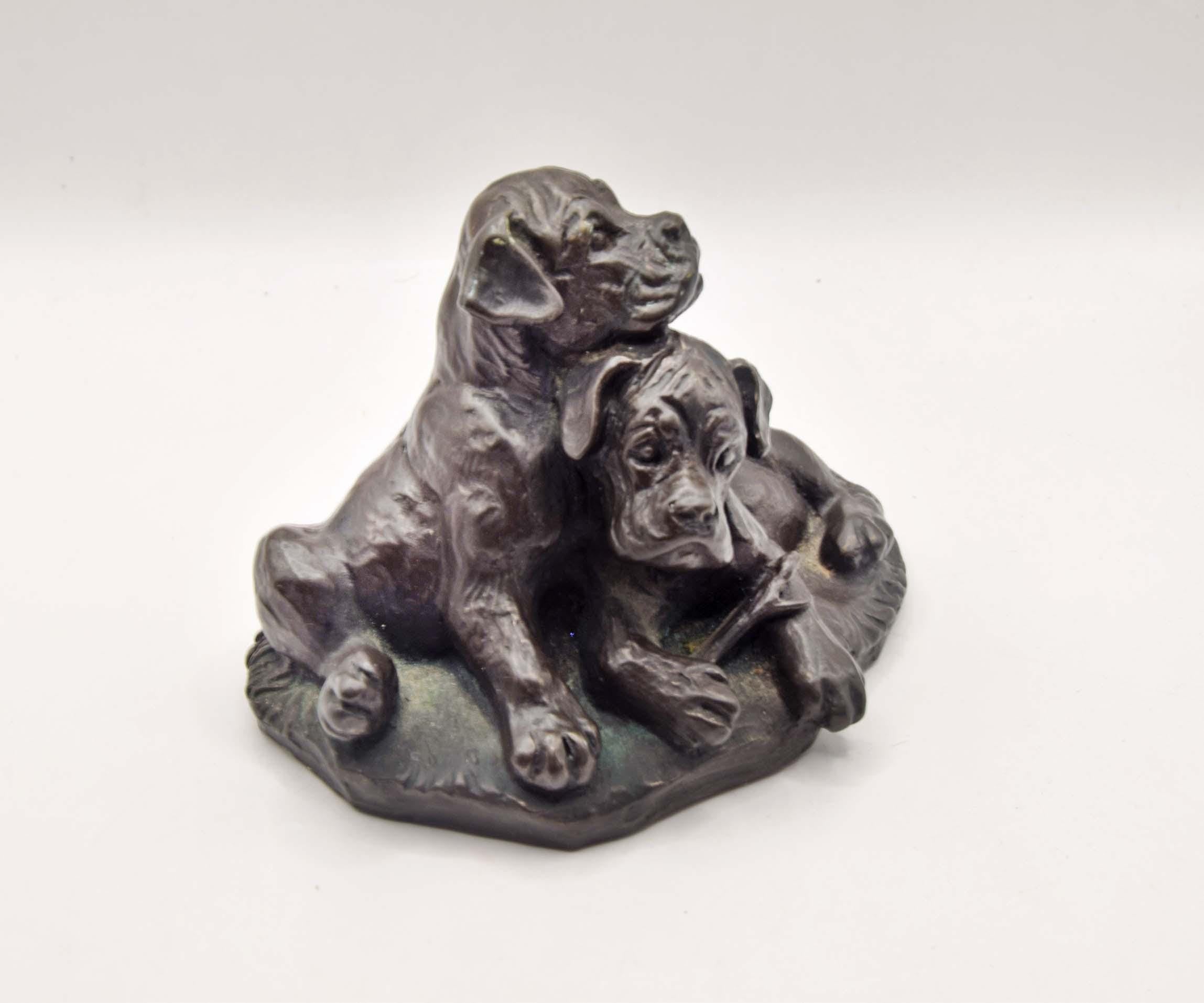 vintage cold cast bronze resin figurine of two boxer puppies, made by the British company Heredities.