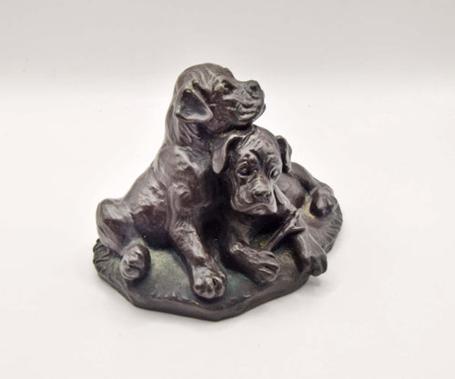 vintage cold cast bronze resin figurine of two boxer puppies, made by the British company Heredities.
