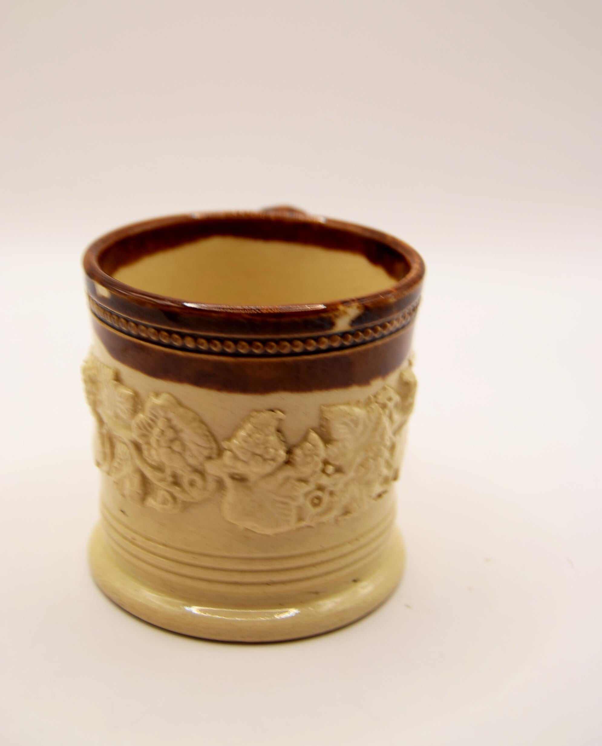 A rare, classic small children's 19th c. English Staffordshire pottery salt glaze cup, mug or coffee can embellished with flowers, l