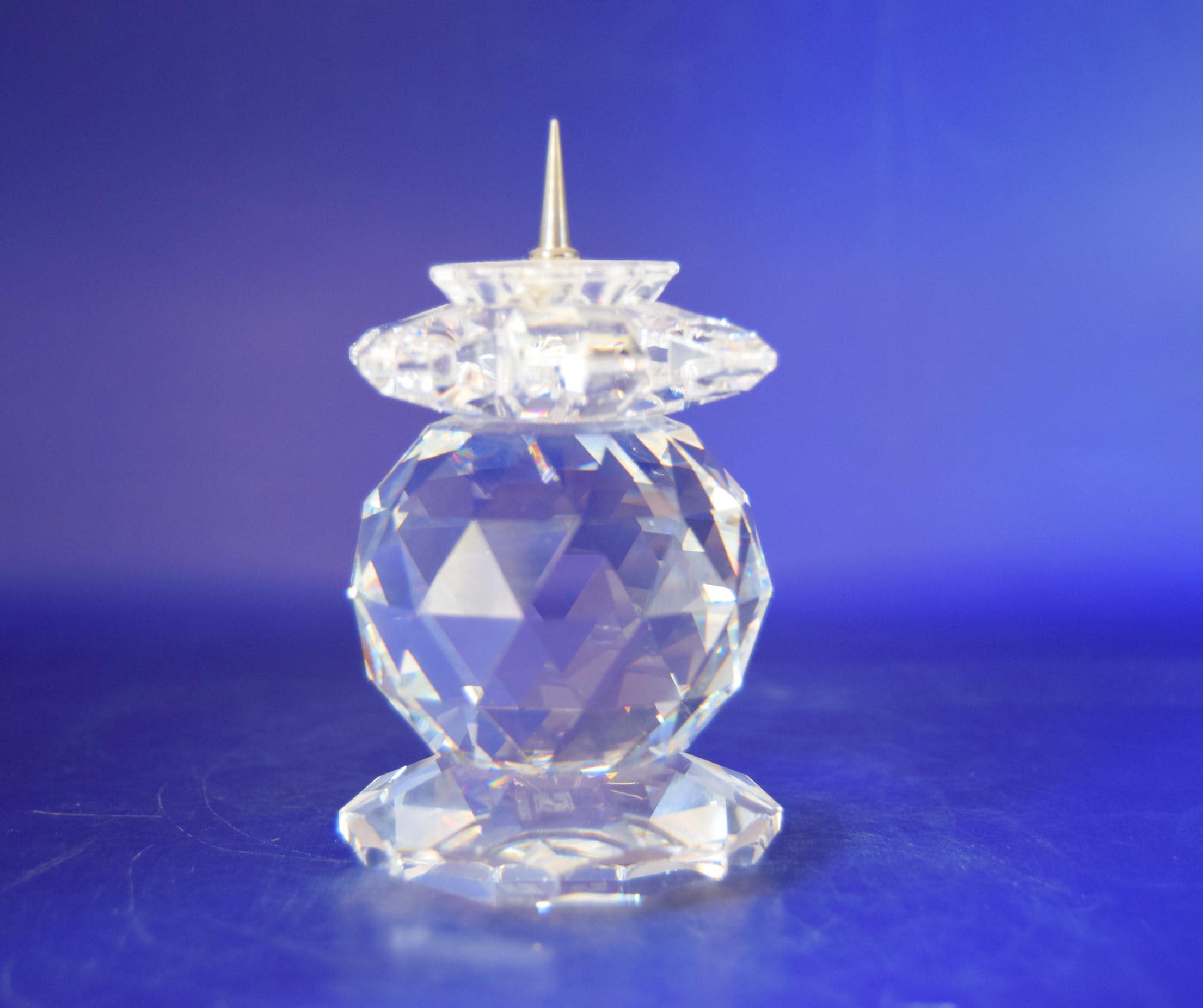 Rare, retired Vintage Swarovski Silver Crystal 103 European Pin-Style Candle Holder. Manufactured between 1976 and 1981, this stunning candlestick holder features an exquisite multi-faceted cut crystal body that captures and refracts light into beautiful rainbow bursts.