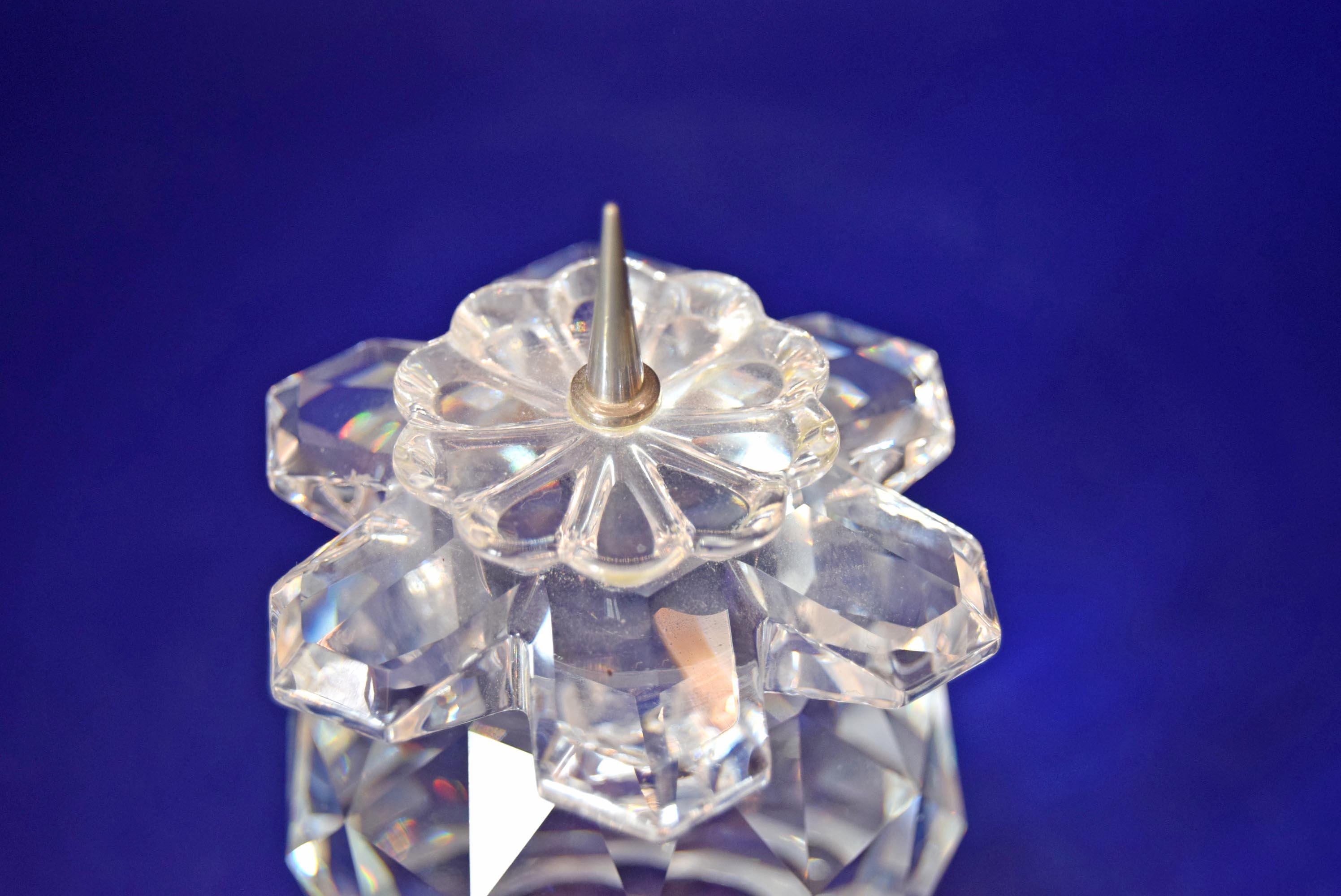 Rare, retired Vintage Swarovski Silver Crystal 103 European Pin-Style Candle Holder. Manufactured between 1976 and 1981, this stunning candlestick holder features an exquisite multi-faceted cut crystal body that captures and refracts light into beautiful rainbow bursts.