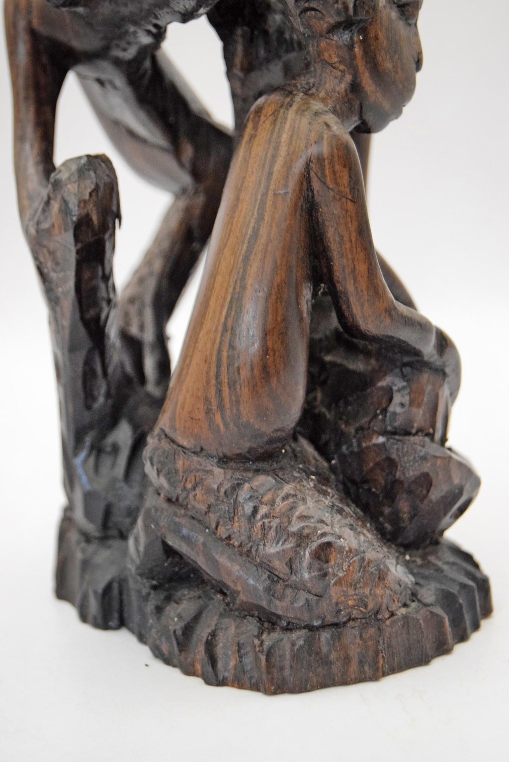 Striking vintage hand-carved Makonde Tree of Life sculpture. Masterfully created by the Makonde people of southeast Tanzania, this mid-century ethnographic piece is carved from a single, solid log of premium, heavy African Ironwood.
The piece features a complex, astonishing network of intricately interlocked human figures climbing upward together. Known traditionally as an Ujamaa or Dimoongo carving, this iconic style represents family unity, ancestral connection, and the structural interdependence of a com