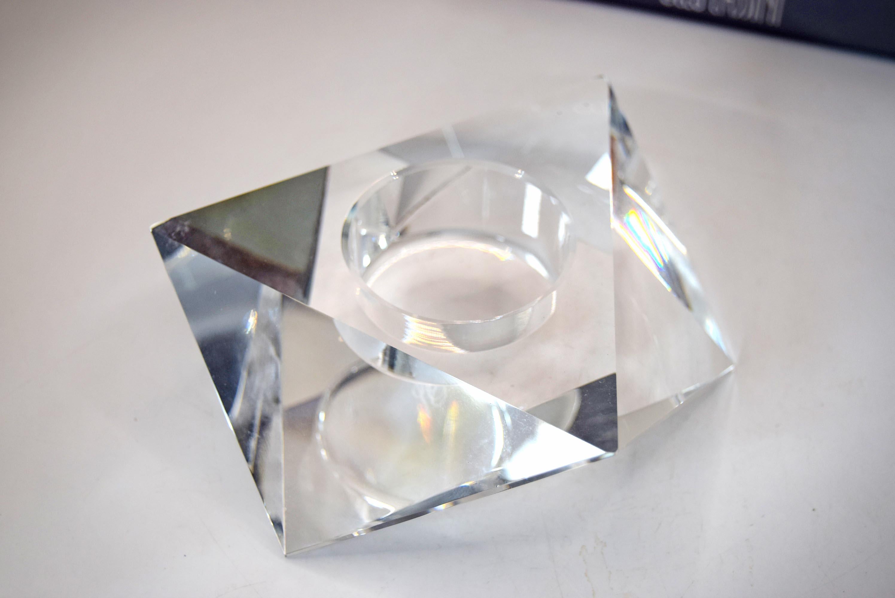multi-faceted geometric design that beautifully catches and refracts candlelight. It bears the etched, signed "Oleg Cassini" signature on the base and comes safely nestled inside its original sleek gray, satin-lined presentation box.