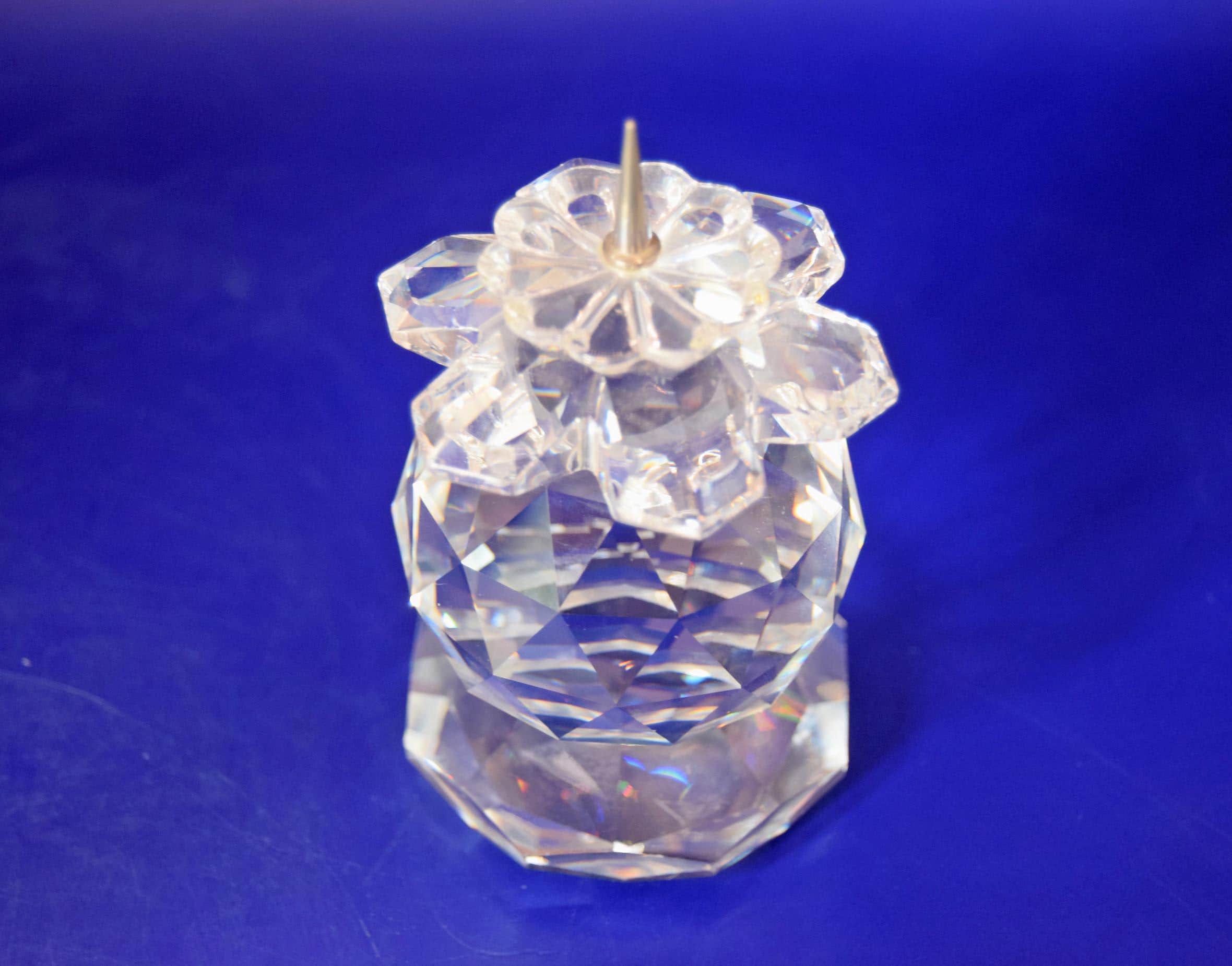 Rare, retired Vintage Swarovski Silver Crystal 103 European Pin-Style Candle Holder. Manufactured between 1976 and 1981, this stunning candlestick holder features an exquisite multi-faceted cut crystal body that captures and refracts light into beautiful rainbow bursts.