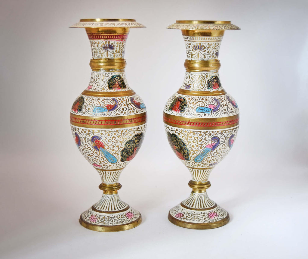 
Stunning Pair of Vintage Kashmiri Meenakari Brass and Enamel Peacock Vases. Masterfully handcrafted in India, these eye-catching mantle urns feature highly detailed, hand-painted majestic peacocks surrounded by intricate white floral scrollwork and vibrant turquoise, red, and gold accents.