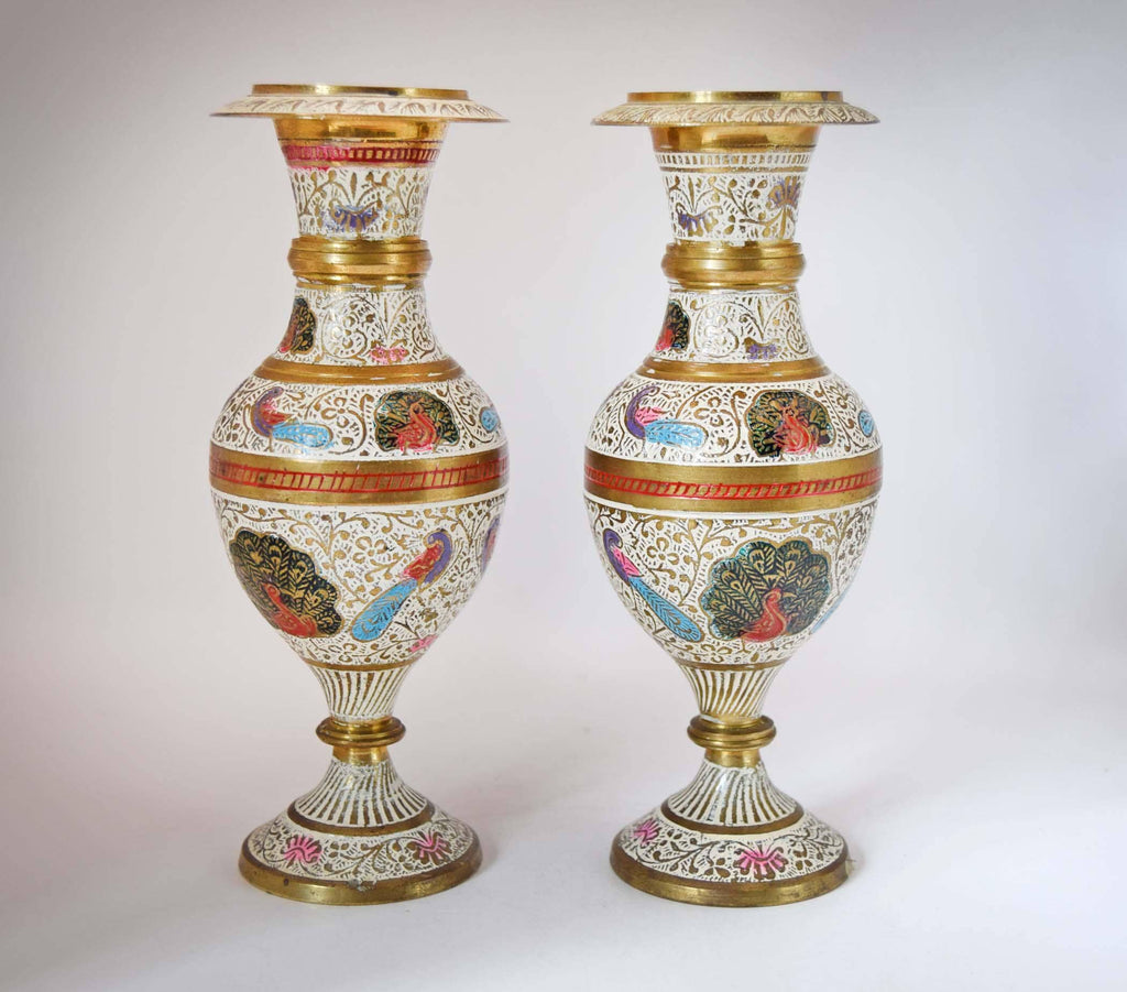 
Stunning Pair of Vintage Kashmiri Meenakari Brass and Enamel Peacock Vases. Masterfully handcrafted in India, these eye-catching mantle urns feature highly detailed, hand-painted majestic peacocks surrounded by intricate white floral scrollwork and vibrant turquoise, red, and gold accents.
