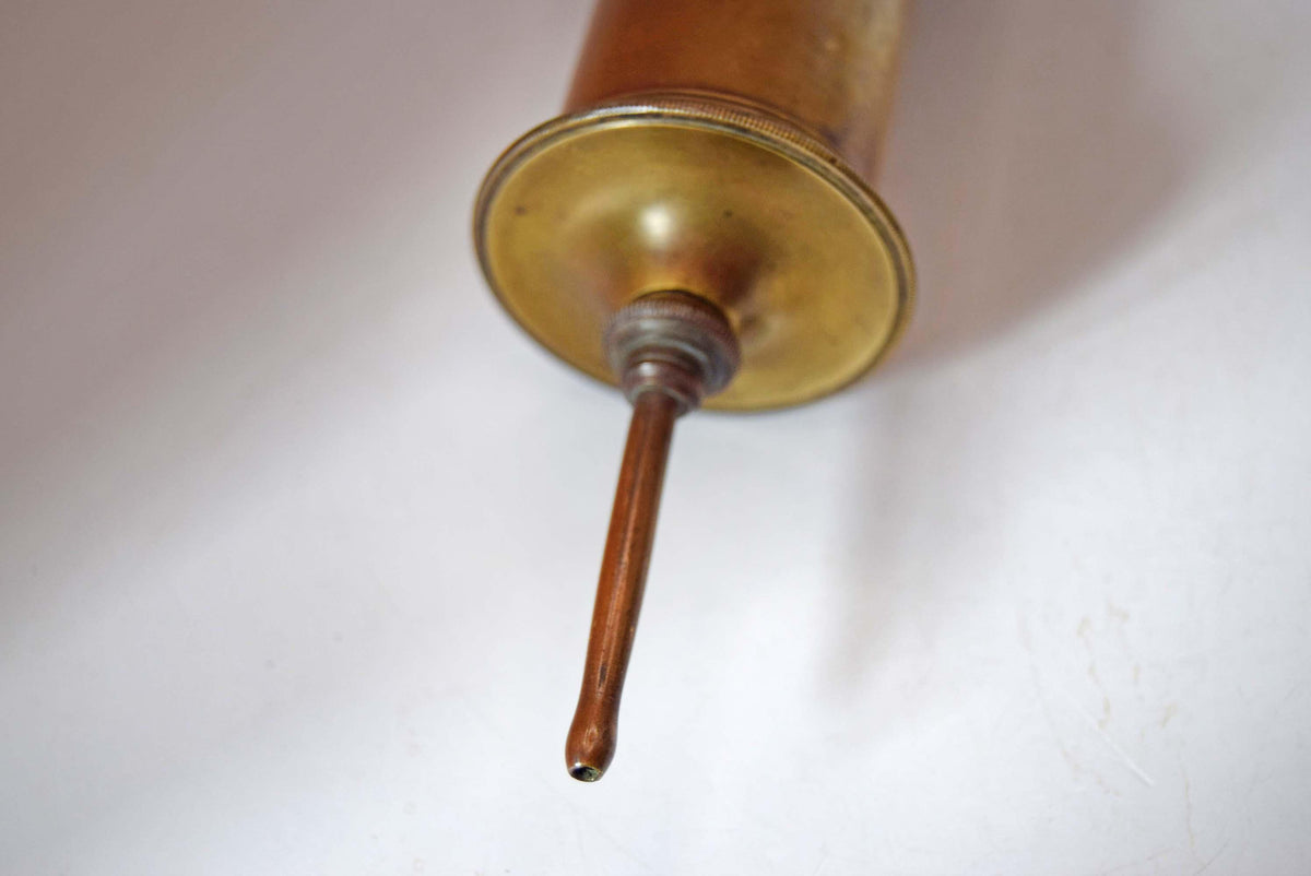 Victorian-era solid brass piston syringe features the highly collectible maker’s mark of S. Maw, Son &amp; Thompson, London. Based on the company's historical name changes, this piece dates precisely between 1870 and 1901, making it a genuine 19th-century artifact.