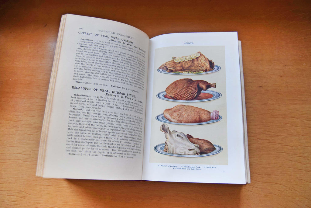 This is a highly sought-after 1923 edition of the quintessential British domestic guide. This specific edition marked a major historical milestone, heavily adapting recipes and household instructions for the post-WWI era—introducing early sections on labor-saving appliances and adapting to a world with fewer domestic servants. It features approximately 1,680 pages, beautiful vibrant color plates, and hundreds of black-and-white illustrations.